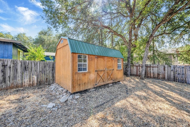 view of shed featuring a fenced backyard