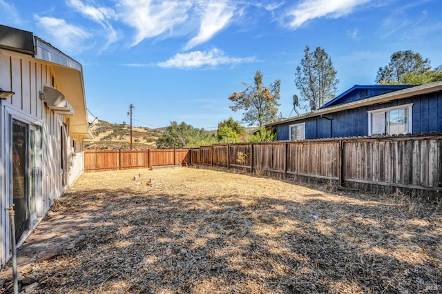 view of yard with a fenced backyard