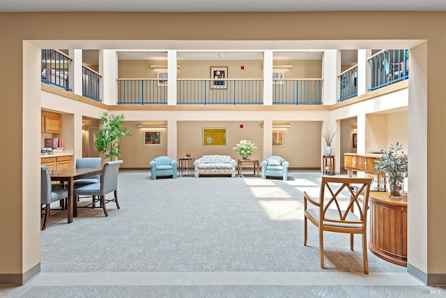 dining area with a healthy amount of sunlight and a tray ceiling