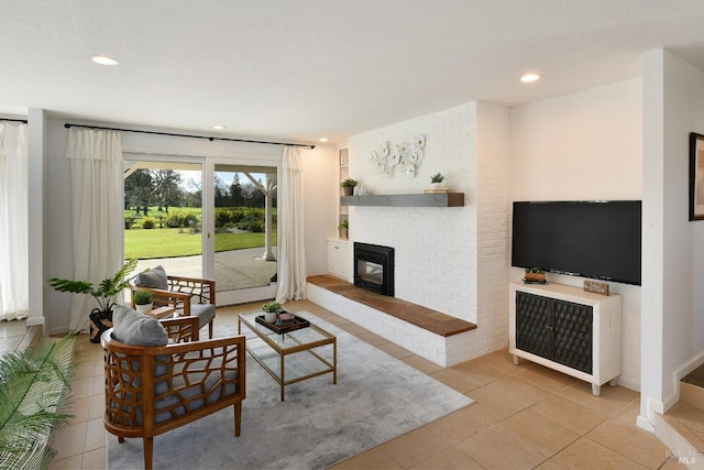 living room with light tile patterned floors and a fireplace