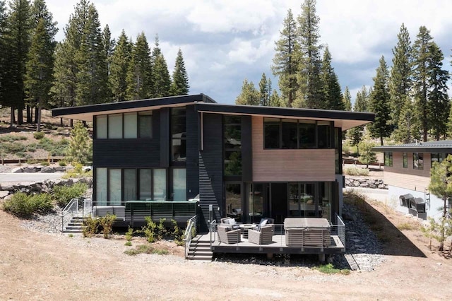 back of house with outdoor lounge area