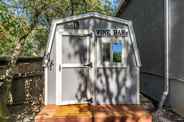 view of shed with fence