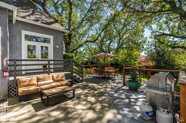 view of patio / terrace featuring an outdoor living space and a grill