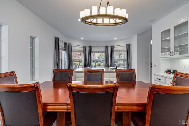 dining space featuring an inviting chandelier