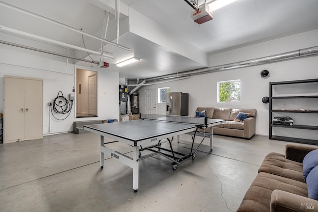 rec room featuring concrete floors