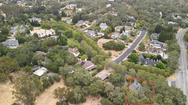 birds eye view of property with a residential view