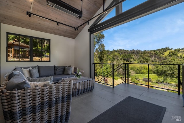 exterior space with wooden ceiling and vaulted ceiling