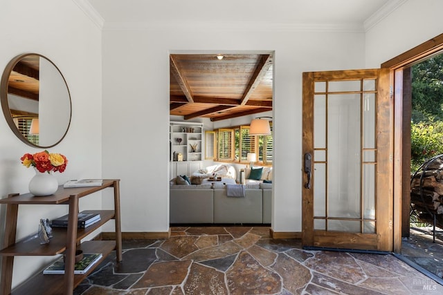 foyer entrance featuring wood ceiling, dark tile patterned floors, and beam ceiling