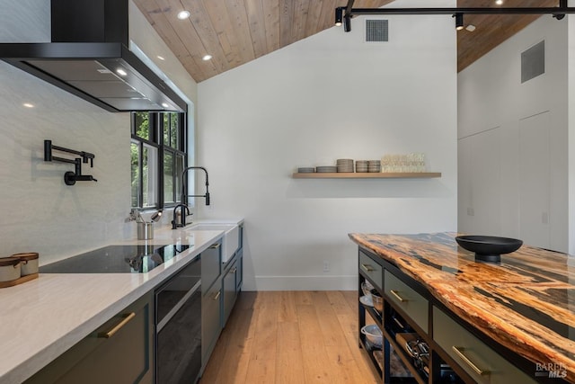 kitchen featuring black electric stovetop, island exhaust hood, light hardwood / wood-style floors, lofted ceiling, and wood ceiling