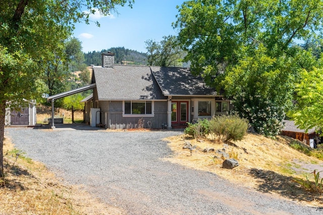 ranch-style home with a carport