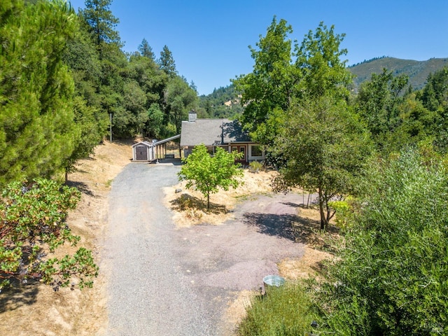 view of front of home featuring a mountain view and a garage