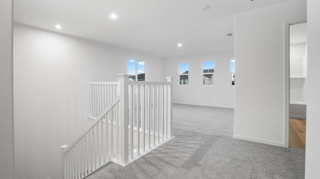 corridor featuring carpet flooring