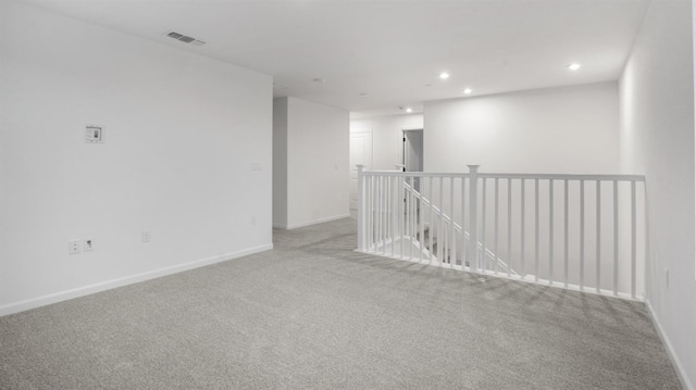 spare room with light colored carpet