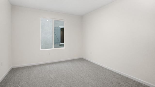 spare room featuring carpet