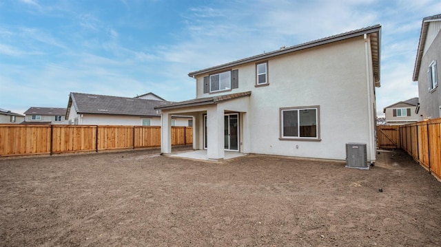 back of property with a patio and cooling unit