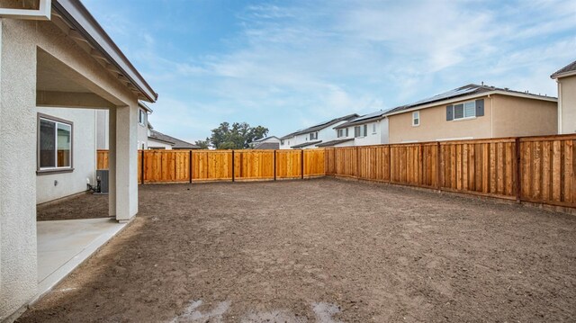 view of yard with a patio and central air condition unit