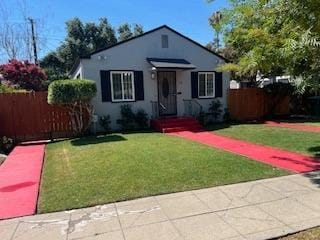 bungalow with a front lawn