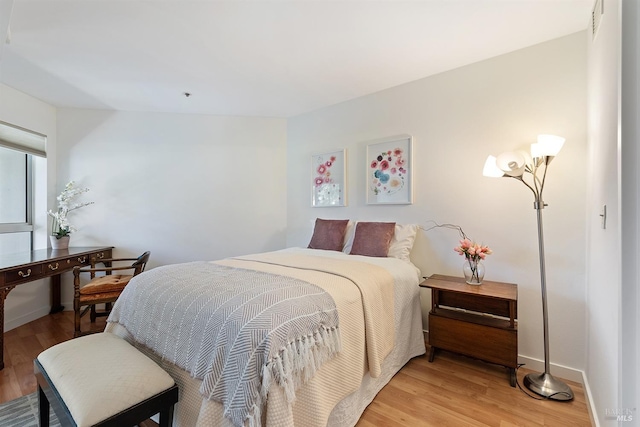 bedroom with light hardwood / wood-style flooring