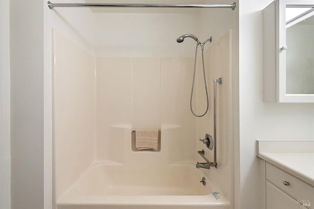 bathroom featuring shower / bath combination and vanity