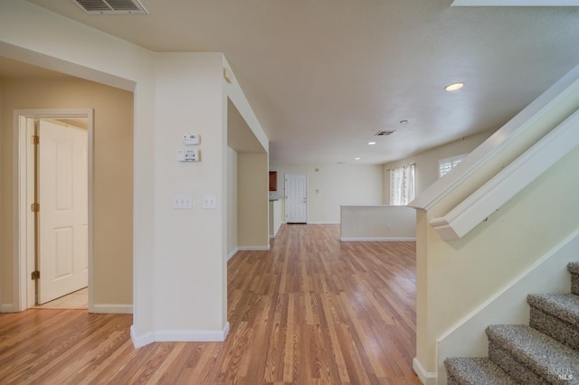 corridor with light wood-type flooring