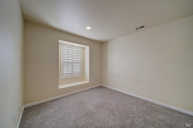 unfurnished room with carpet floors