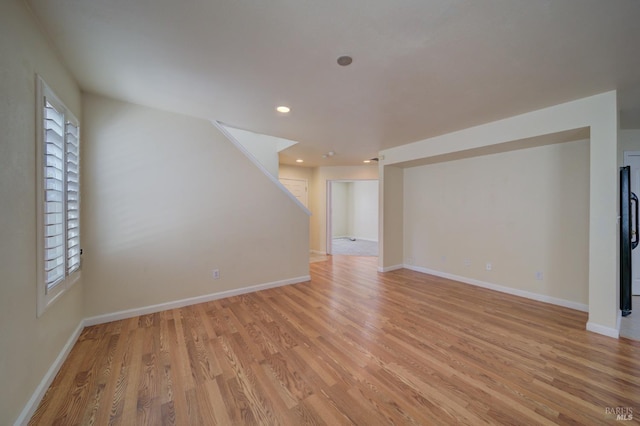 unfurnished living room with light hardwood / wood-style flooring