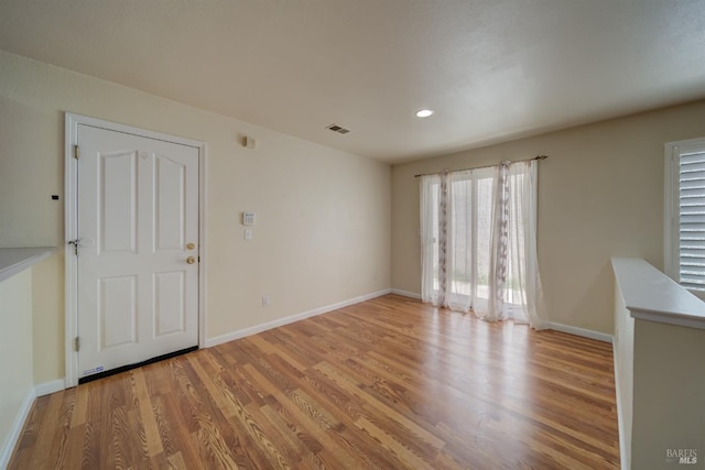 spare room with light wood-type flooring