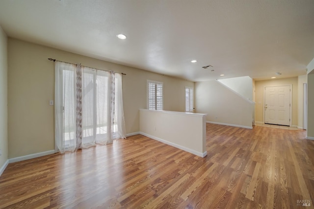 spare room with light wood-type flooring