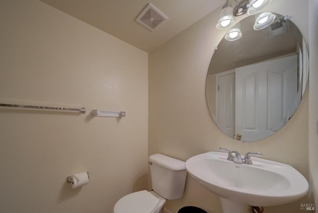 bathroom with toilet and sink