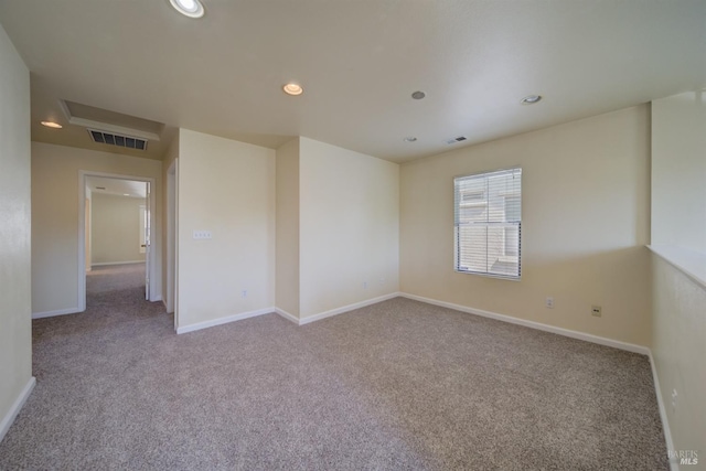 unfurnished room featuring light colored carpet