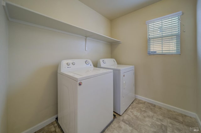 clothes washing area with washer and dryer