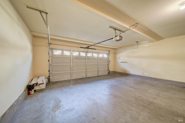 garage featuring a garage door opener