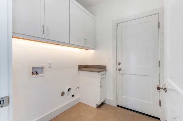 laundry room featuring washer hookup, hookup for a gas dryer, and cabinets