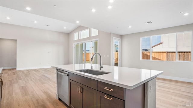 kitchen featuring dark brown cabinetry, light hardwood / wood-style flooring, sink, and stainless steel dishwasher