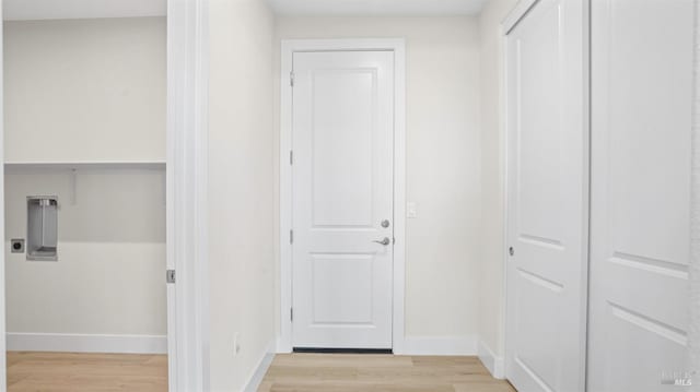 hallway with light wood-type flooring