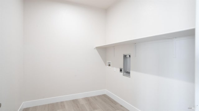 laundry area featuring hookup for an electric dryer, washer hookup, and light hardwood / wood-style floors