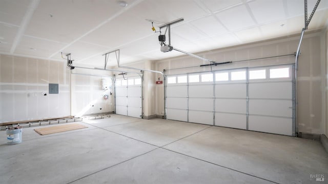 garage featuring a garage door opener and electric panel