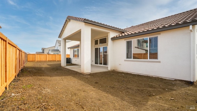 rear view of house featuring a patio area