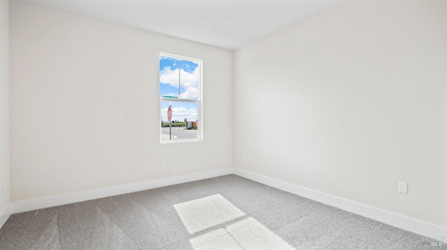 unfurnished room featuring carpet