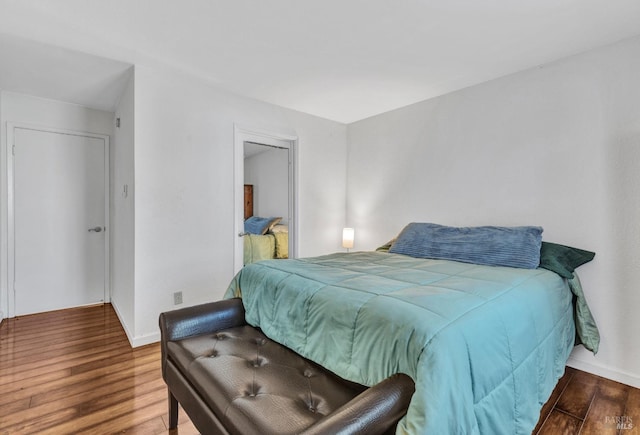 bedroom with hardwood / wood-style flooring