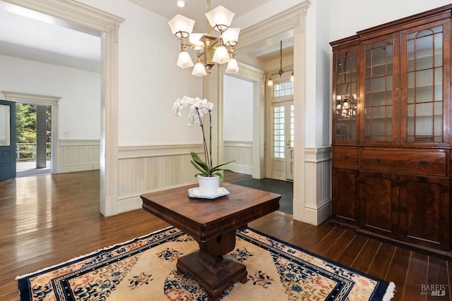 dining space featuring a notable chandelier and dark wood-type flooring