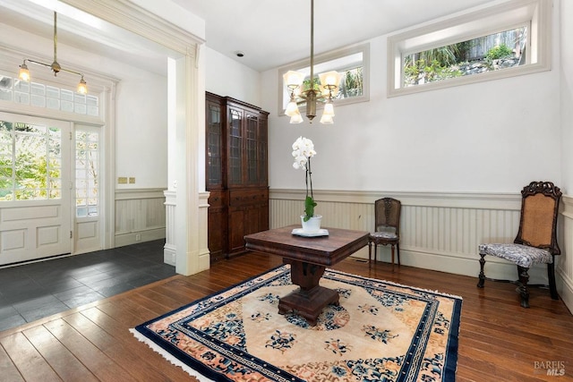 interior space featuring dark hardwood / wood-style flooring and a notable chandelier