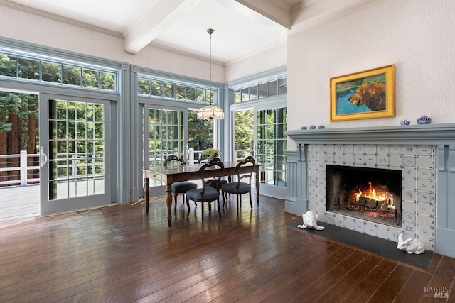 dining room featuring hardwood / wood-style flooring, ornamental molding, beam ceiling, and coffered ceiling