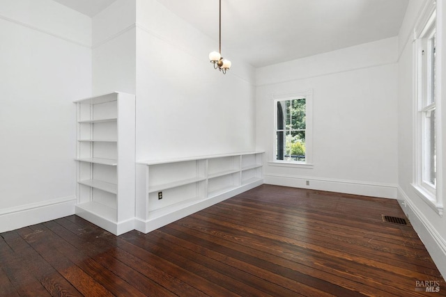 empty room with dark hardwood / wood-style floors