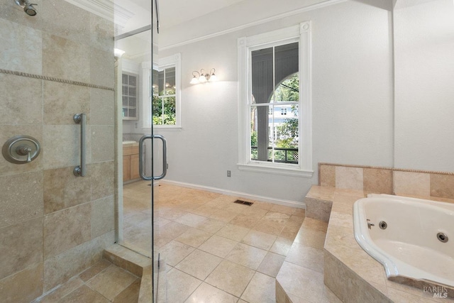 bathroom featuring tile patterned floors and separate shower and tub