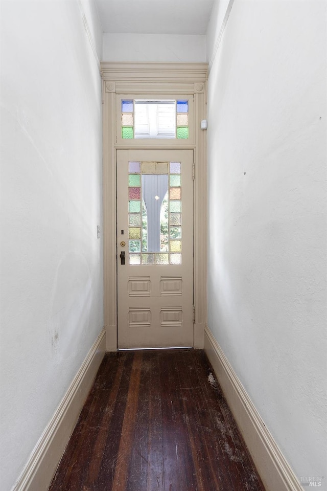 entryway with dark hardwood / wood-style flooring