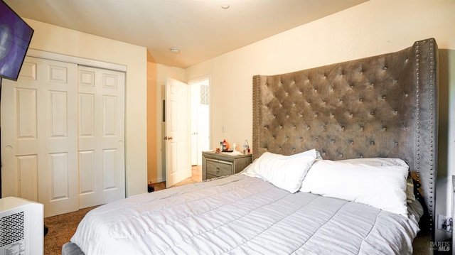 carpeted bedroom featuring a closet