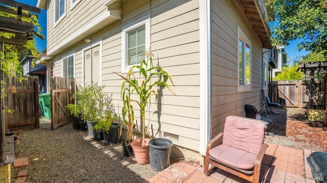 exterior space with a patio and fence