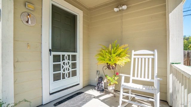 doorway to property featuring covered porch