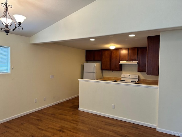 kitchen featuring a notable chandelier, decorative light fixtures, white fridge, stove, and dark wood-type flooring